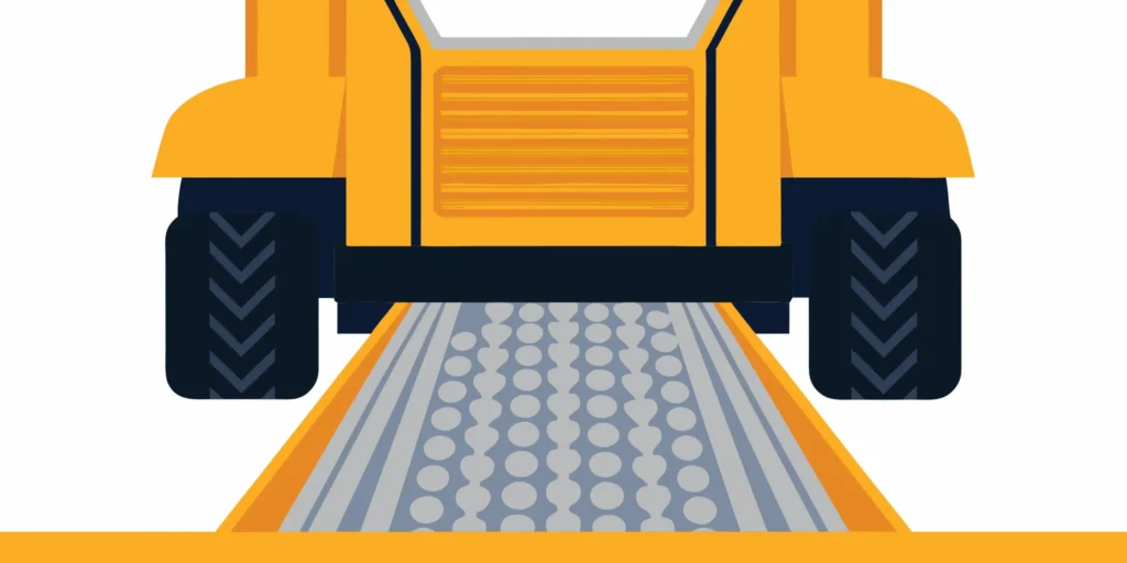 Using a skid steer is the best way to spread gravel for a driveway.